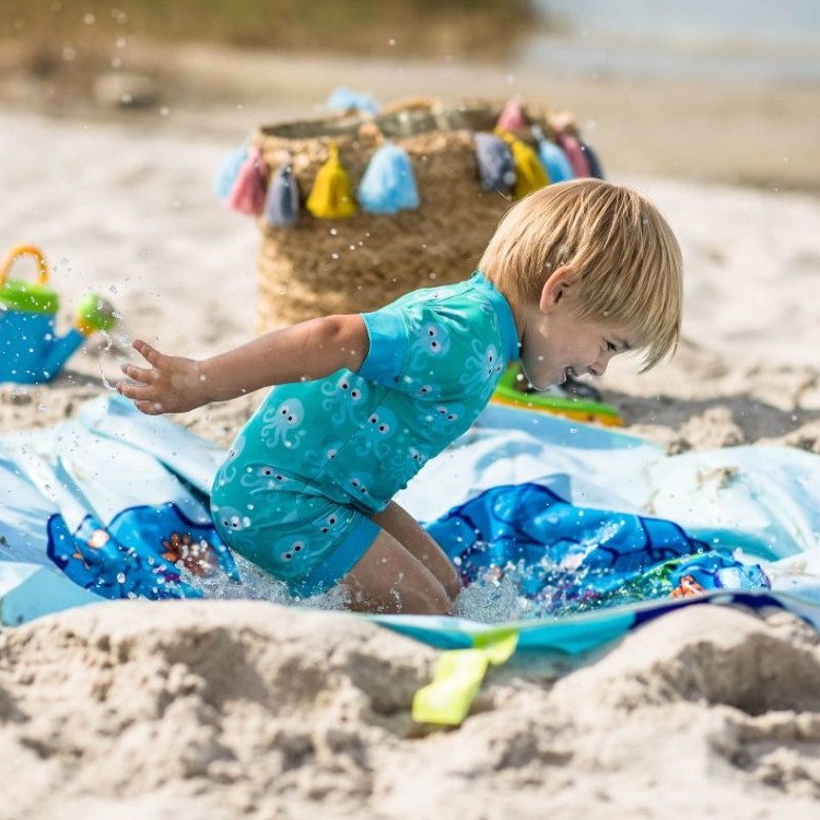 Basseng og strandteppe